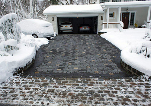 The completed radiant heated driveway after a snowstorm.